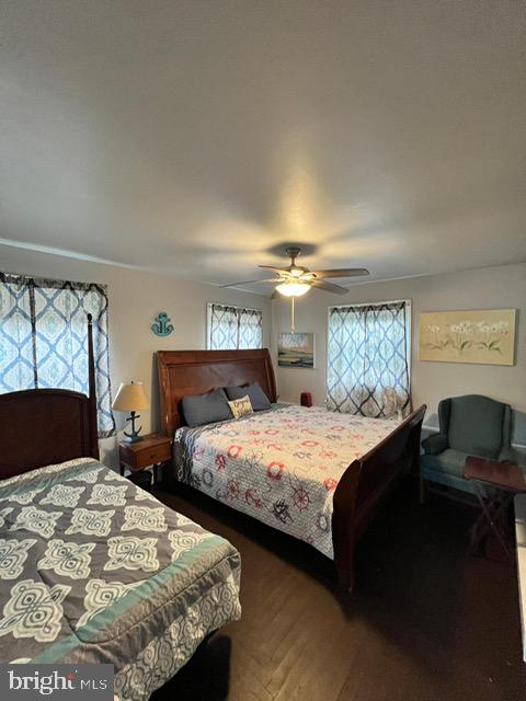 114 Hall Highway Crisfield, MD 21817 - Photo 19 of 30 a bedroom with two beds and a window