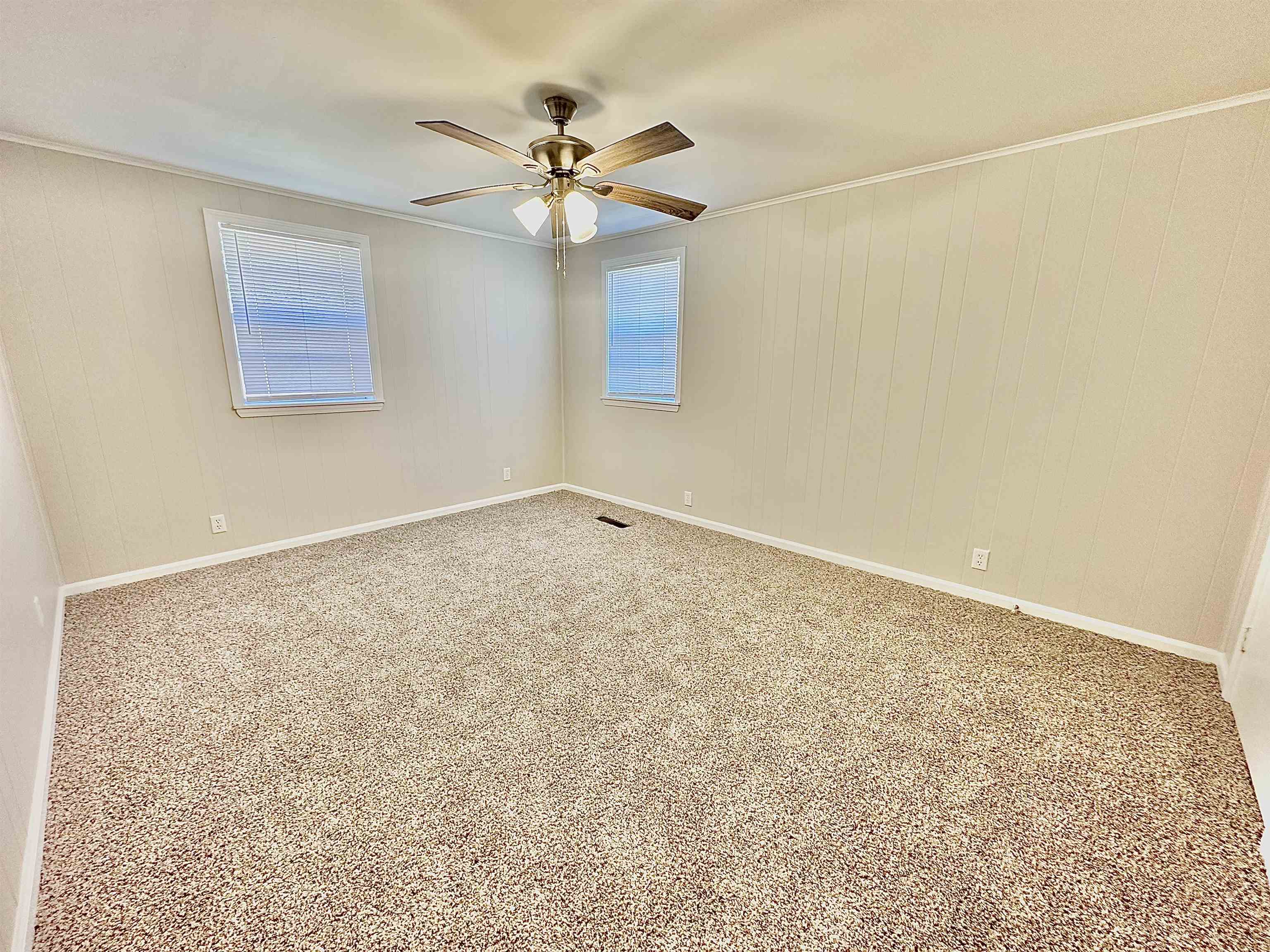 4346 Benjestown Road Memphis, TN 38127 - Photo 10 of 18 Spare room with visible vents, ornamental molding, carpet flooring, baseboards, and ceiling fan