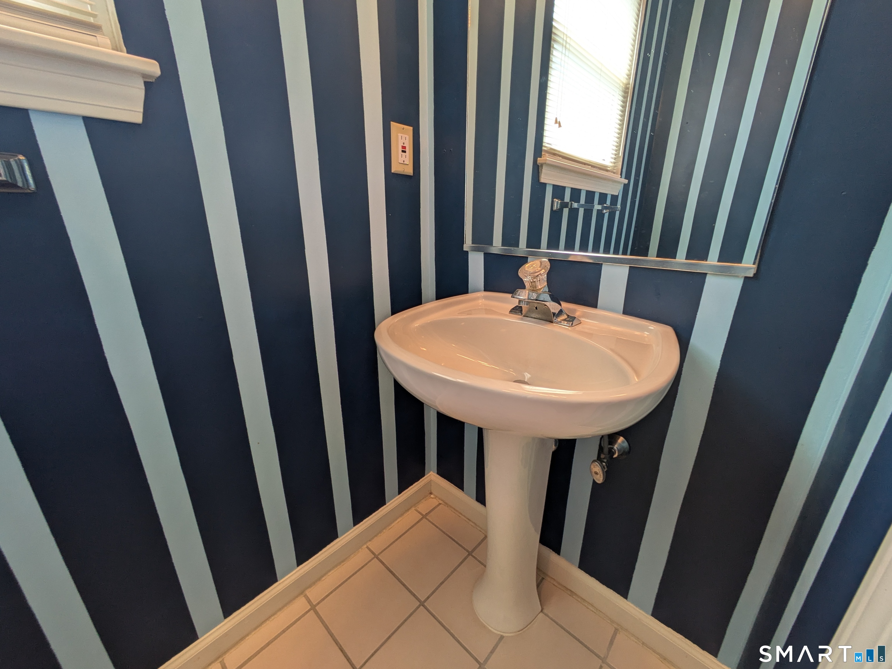 61 Basking Brook Road Shelton, CT 06484 - Photo 11 of 25 a view of a bathroom with a sink and tub