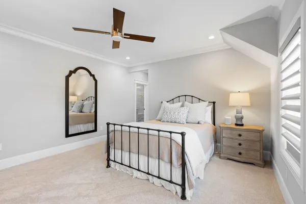 a bedroom with a bed and a dresser