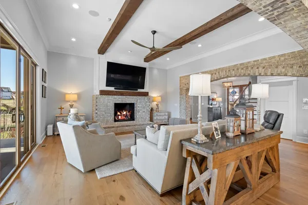 a living room with fireplace furniture and a flat screen tv