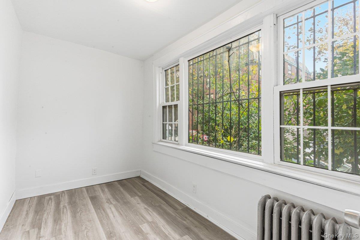 33-43 83rd Street Queens, NY 11372 - Photo 11 of 38 a view of an empty room and window