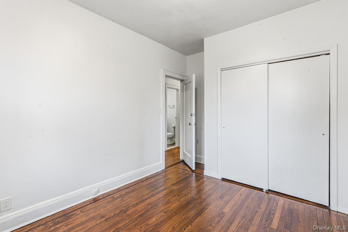 33-43 83rd Street Queens, NY 11372 - Photo 16 of 38 a view of an empty room with wooden floor and a window