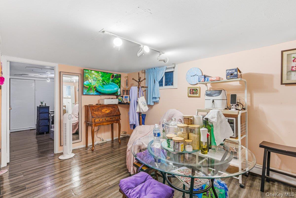 33-43 83rd Street Queens, NY 11372 - Photo 18 of 38 a living room with furniture and a wooden floor
