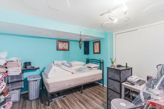 a bedroom with bed and a window