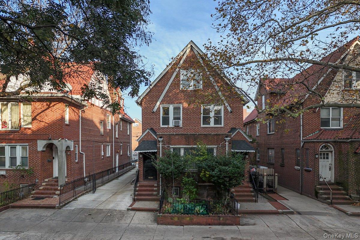33-43 83rd Street Queens, NY 11372 - Photo 2 of 38 a front view of a house with garden