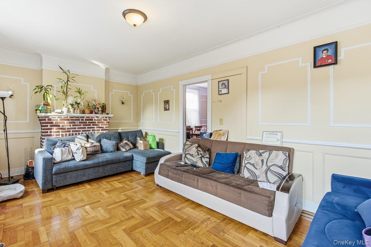 33-43 83rd Street Queens, NY 11372 - Photo 26 of 38 a living room with furniture and a couch