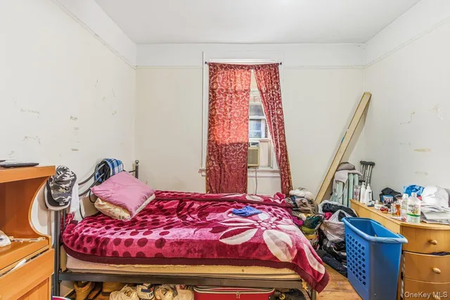 a bed room with a bed and a window