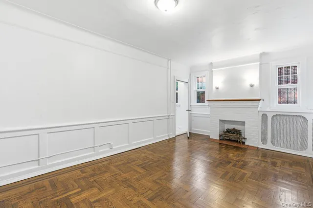 a view of a livingroom with furniture a fireplace