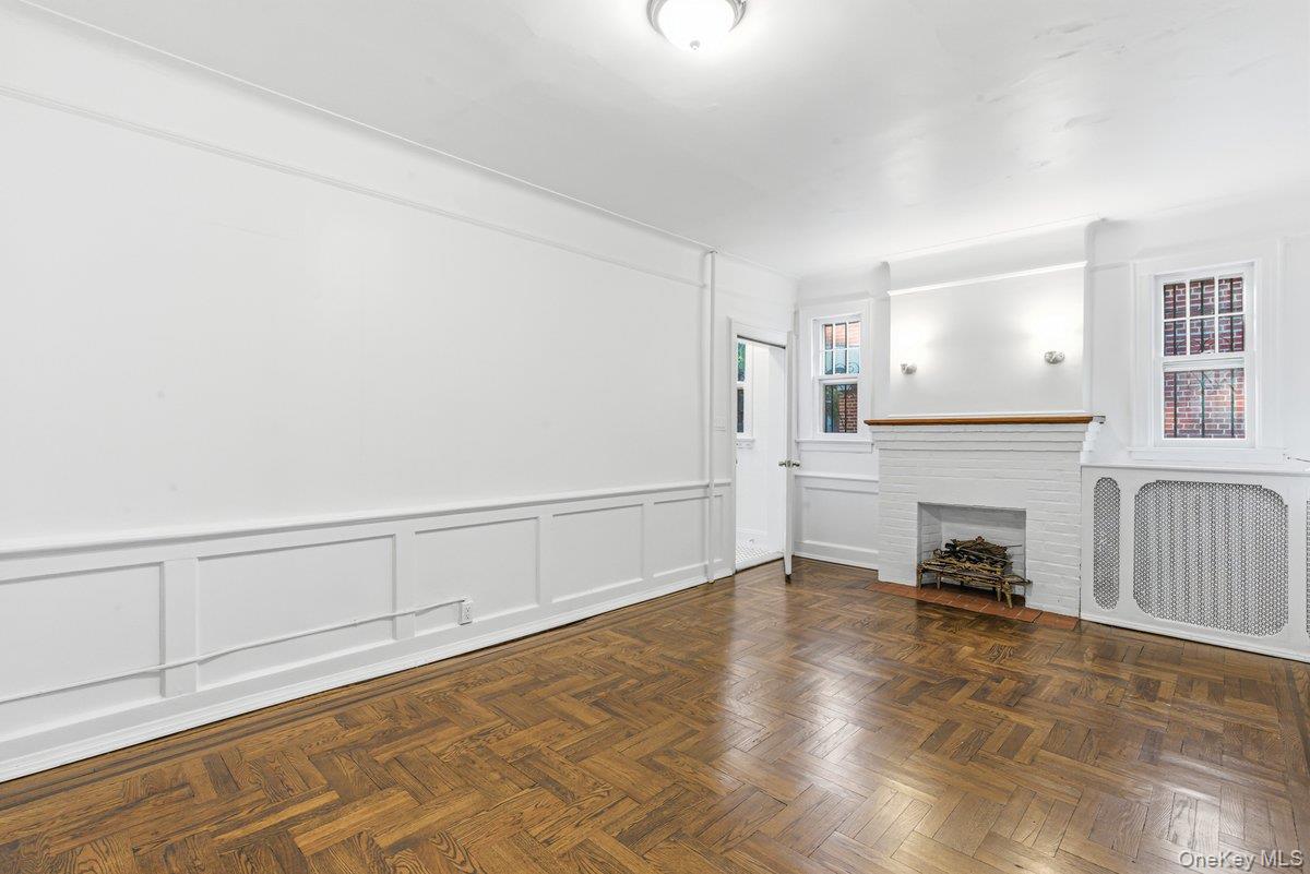 33-43 83rd Street Queens, NY 11372 - Photo 8 of 38 a view of a livingroom with furniture a fireplace