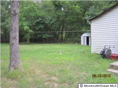 25 Windeler Road Howell, NJ 07731 - Photo 2 of 3 a backyard of a house with seating area