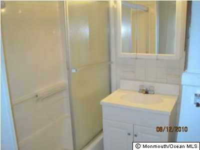 25 Windeler Road Howell, NJ 07731 - Photo 3 of 3 a bathroom with a sink and a mirror
