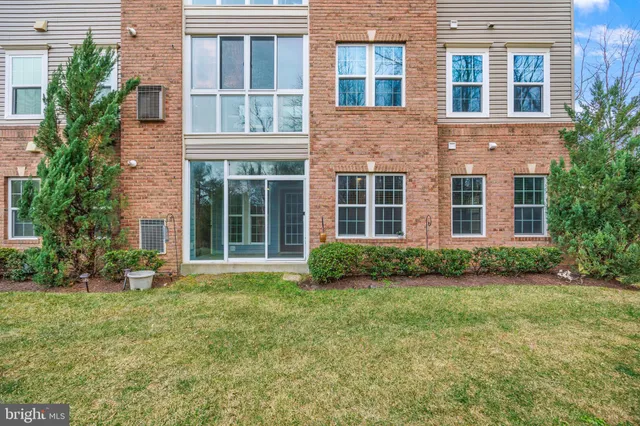 a view of a building next to a yard