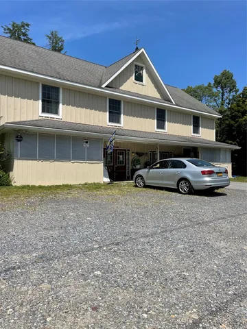 a front view of a house with parking space