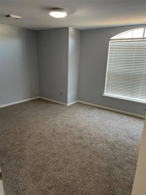 2103 Ragland Drive Houston, TX 77067 - Photo 18 of 18 an empty room with a window