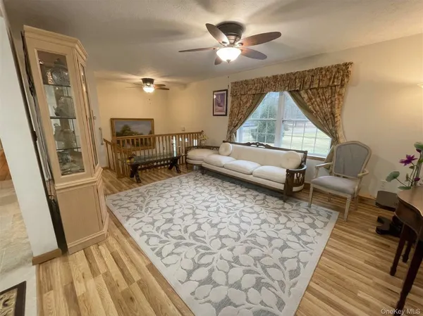 a living room with furniture and a rug