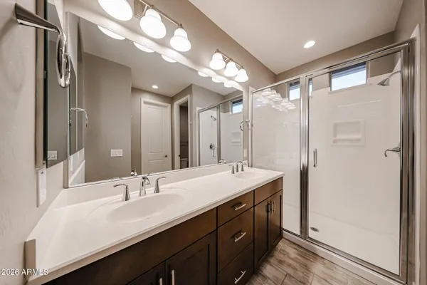 a bathroom with a double vanity sink mirror and double