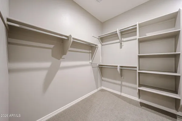 a view of an empty walk in closet