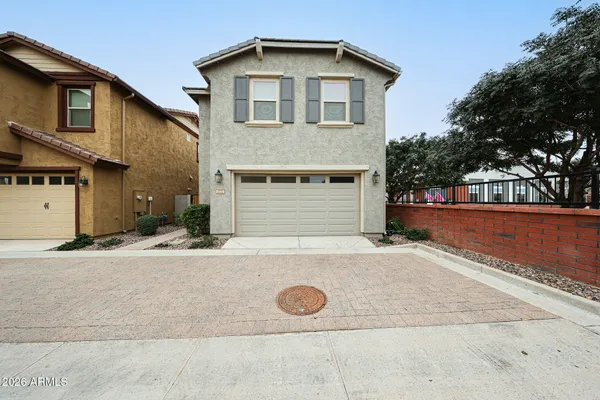 a front view of a house with garage