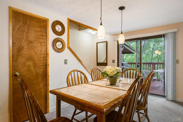 a kitchen with a sink refrigerator and cabinets