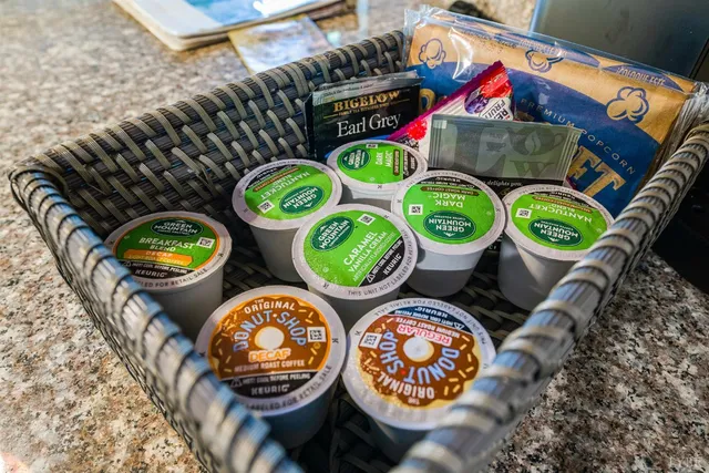 a view of a wooden chairs and table in the deck