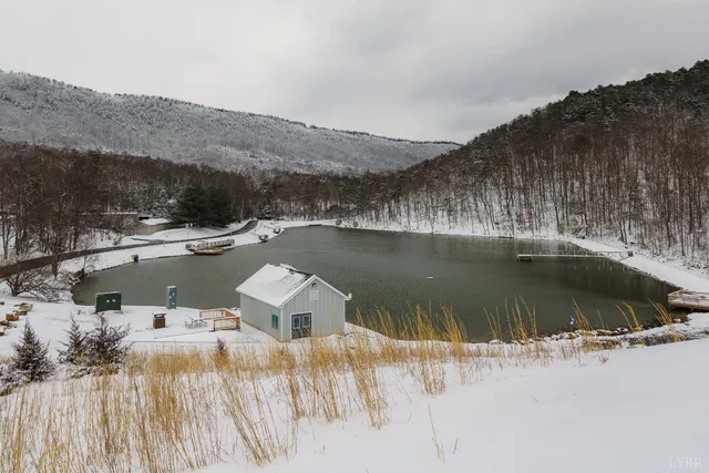 an aerial view of residential houses with outdoor space and street view