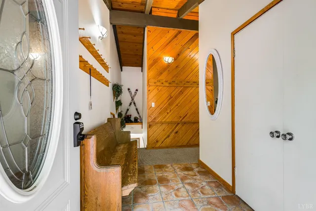 a view of a blue door and chair in a room