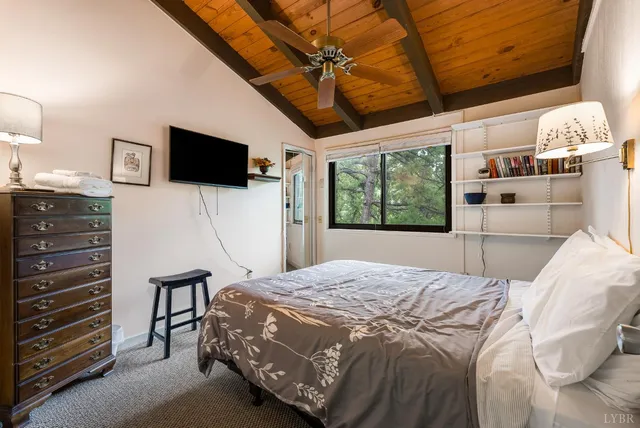 a bed room with a bed and a window