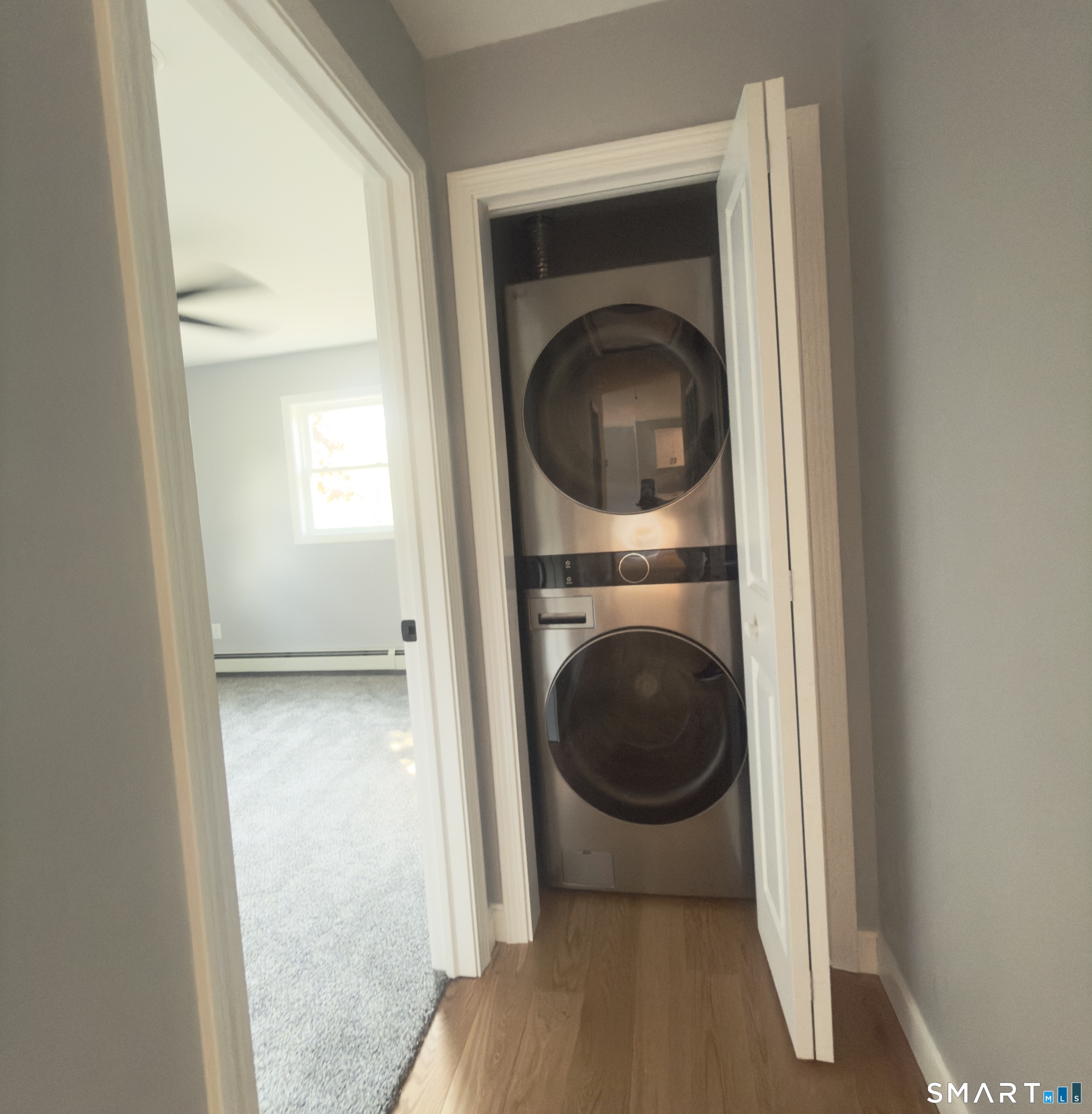 44 Polly Avenue Killingly, CT 06239 - Photo 21 of 22 a view of a hallway with washer and dryer