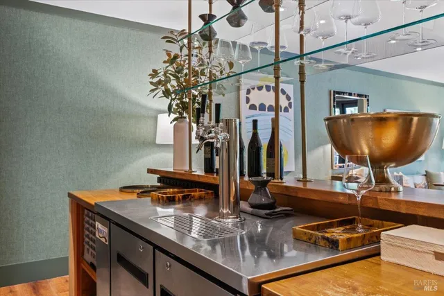 a bathroom with a granite countertop sink and a toilet