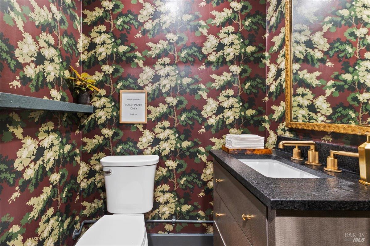 320 Center Street Healdsburg, CA 95448 - Photo 18 of 56 a bathroom with a granite countertop sink and a toilet