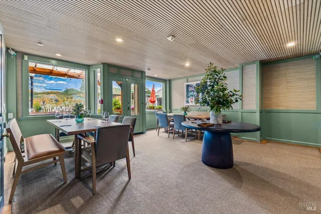a kitchen with a table and chairs