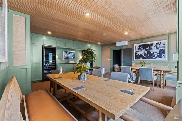 a kitchen with kitchen island a counter top space a sink and stainless steel appliances