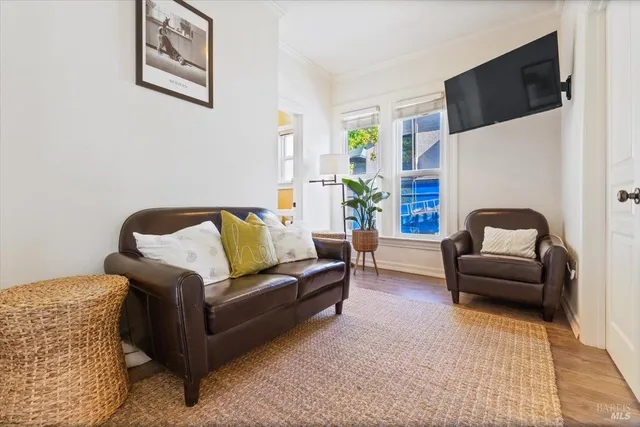 a kitchen with kitchen island granite countertop a sink a stove and cabinets
