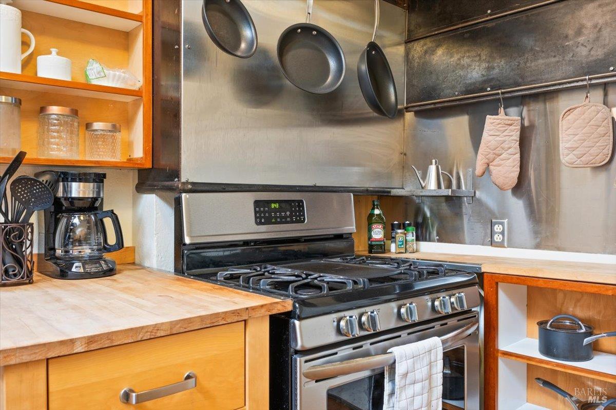 320 Center Street Healdsburg, CA 95448 - Photo 46 of 56 a kitchen with a stove and a sink