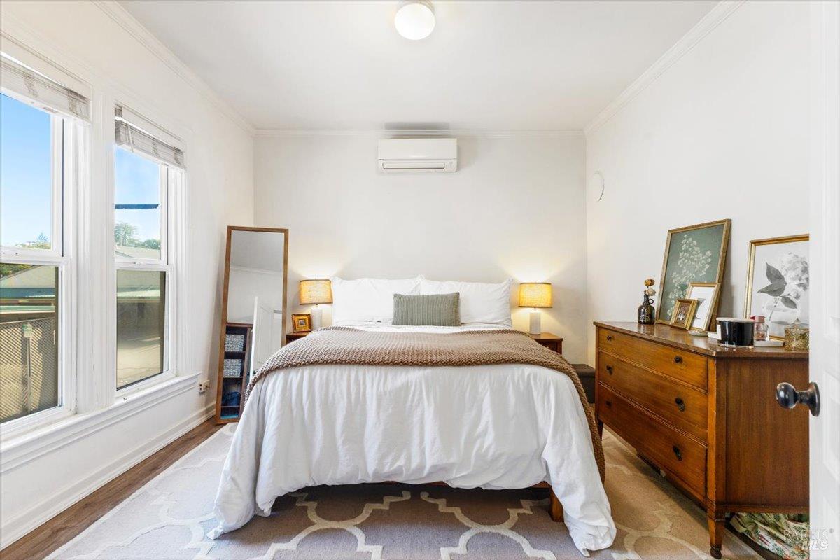 320 Center Street Healdsburg, CA 95448 - Photo 52 of 56 a bedroom with a bed and a dresser next to a window