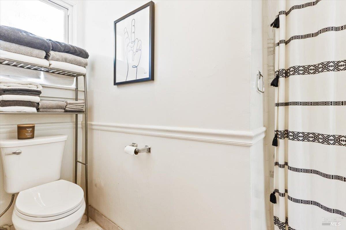 320 Center Street Healdsburg, CA 95448 - Photo 55 of 56 a white toilet sitting next to a bathroom sink