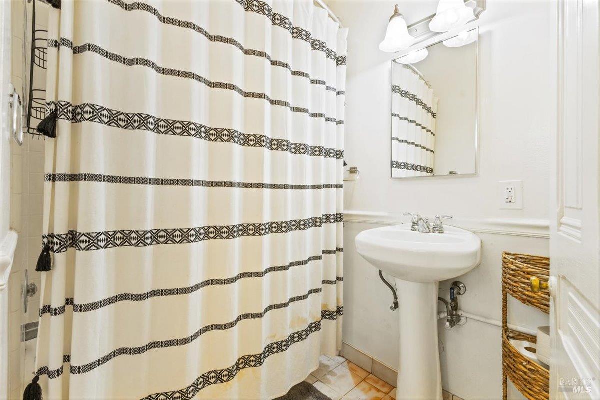 320 Center Street Healdsburg, CA 95448 - Photo 56 of 56 a bathroom with a sink and mirror