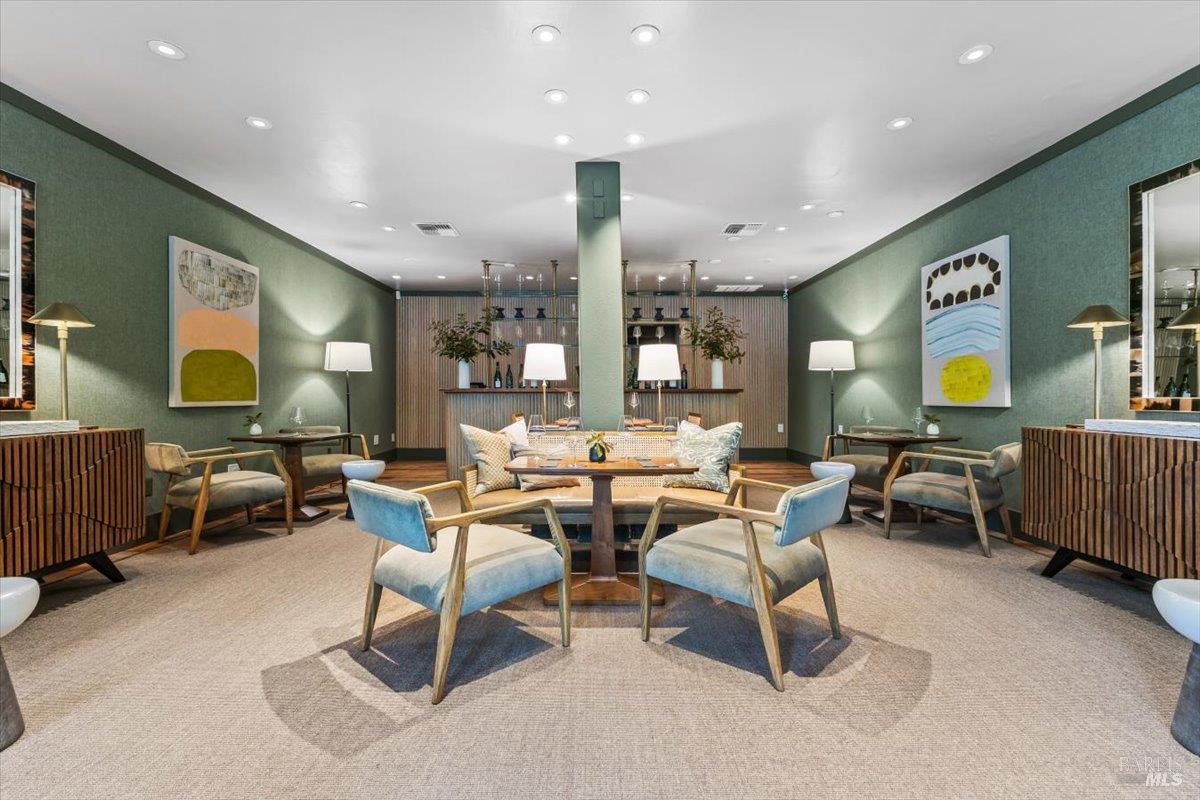 320 Center Street Healdsburg, CA 95448 - Photo 8 of 56 a living room with couches and kitchen view with wooden floor