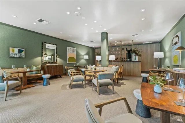 a view of a dining room with furniture water and a chandelier