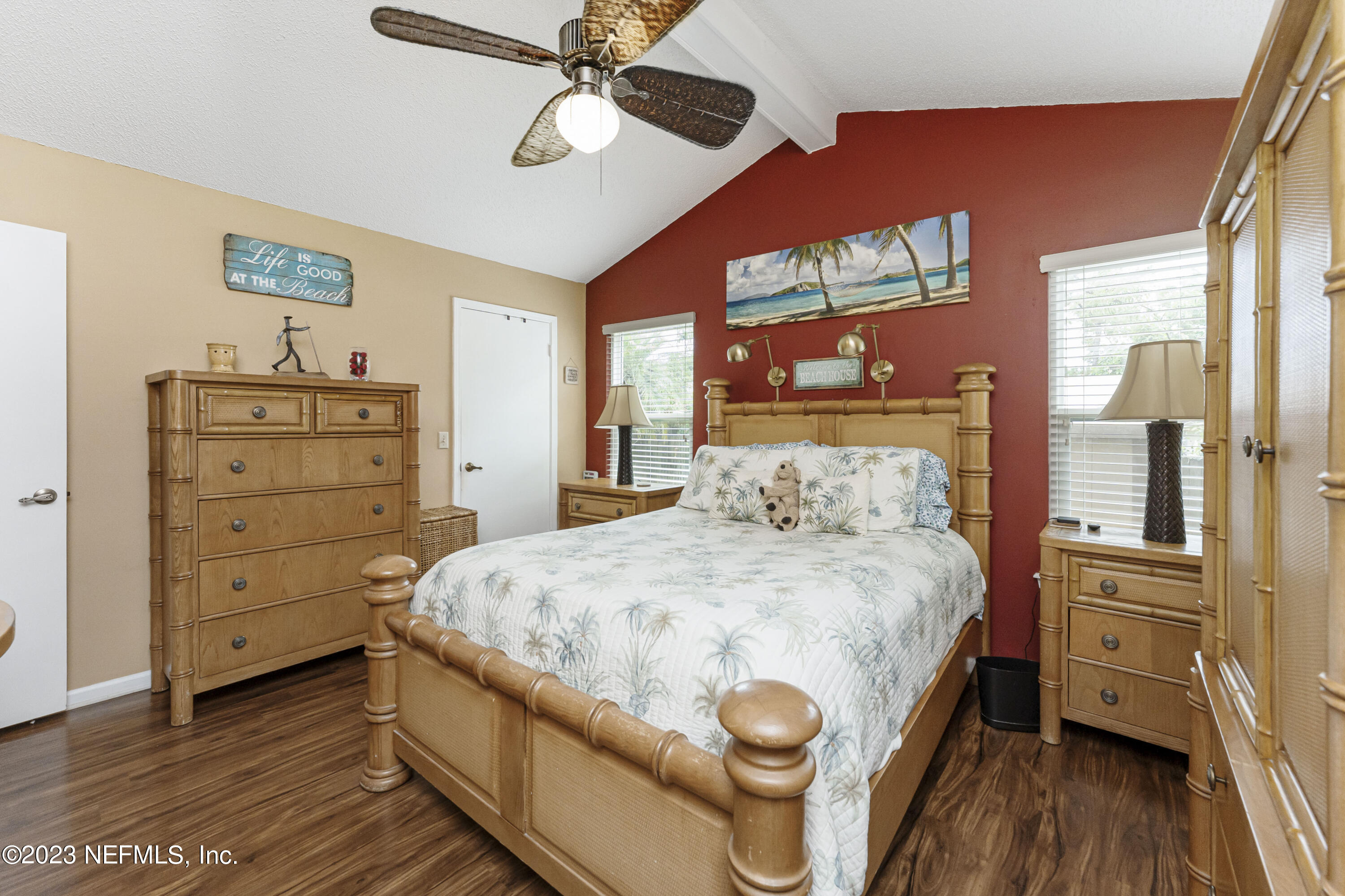 1676 Westwind Drive Jacksonville Beach, FL 32250 - Photo 12 of 42 a bedroom with a bed and wooden floor