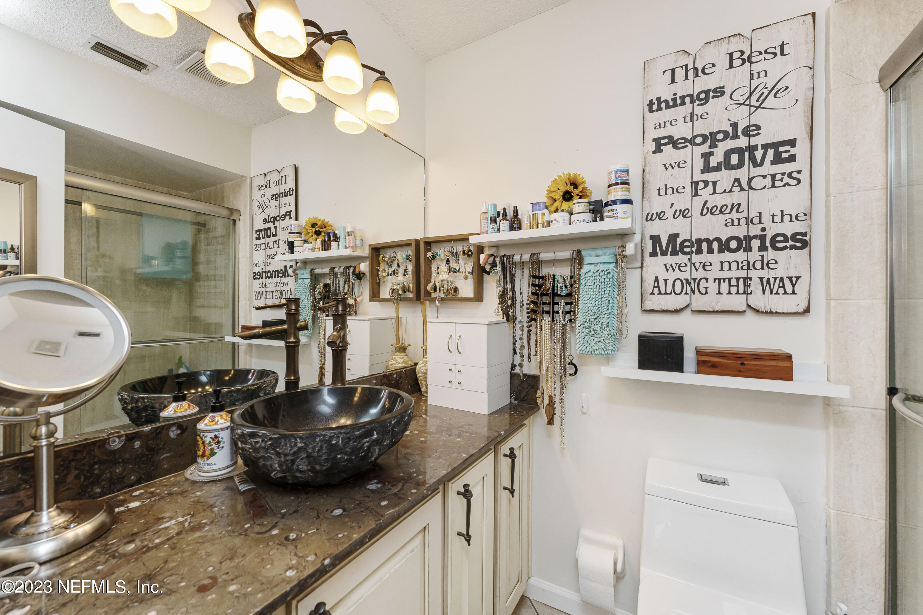 1676 Westwind Drive Jacksonville Beach, FL 32250 - Photo 14 of 42 a kitchen with a sink a stove and a chandelier