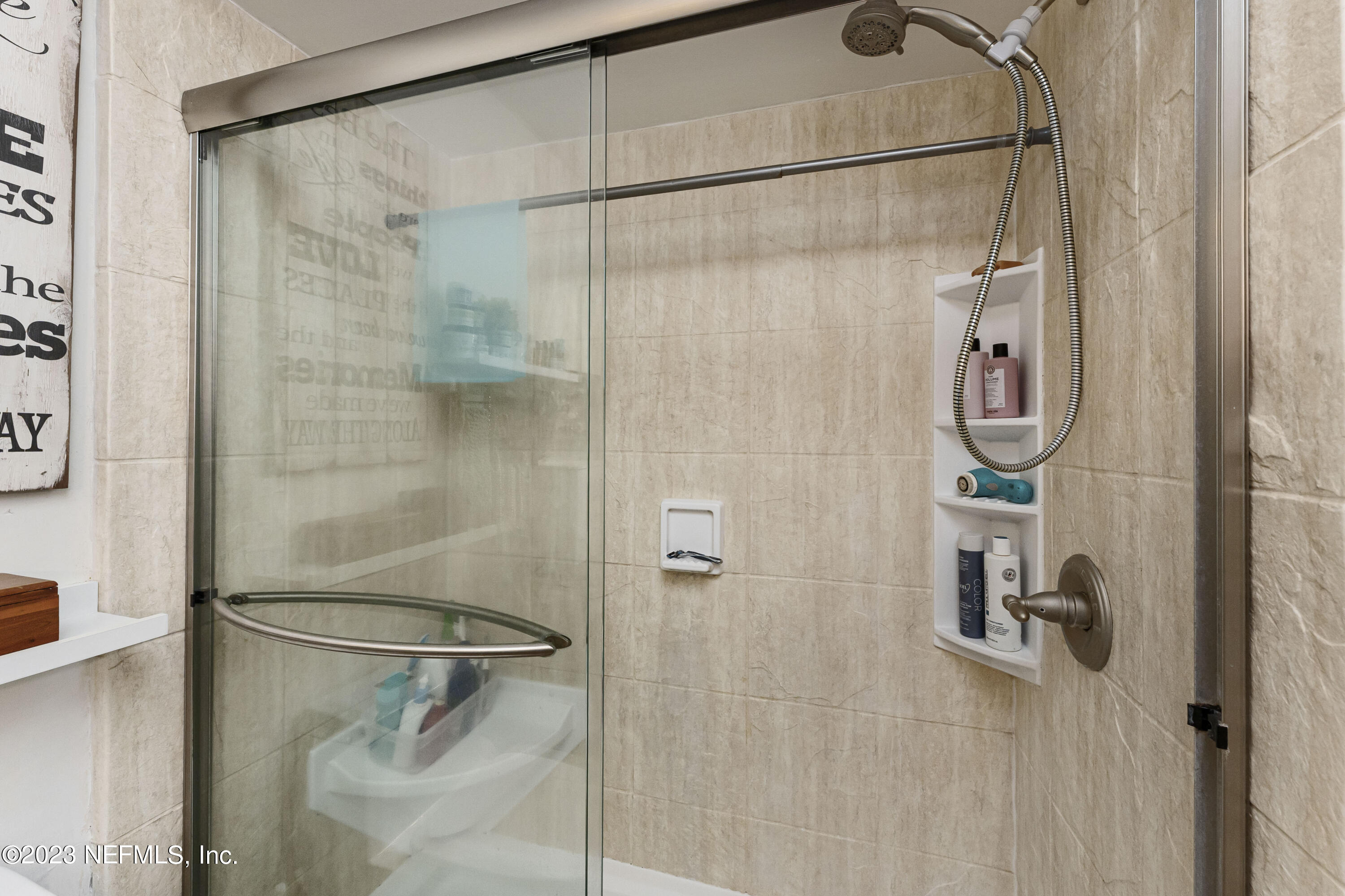 1676 Westwind Drive Jacksonville Beach, FL 32250 - Photo 15 of 42 a bathroom with a shower