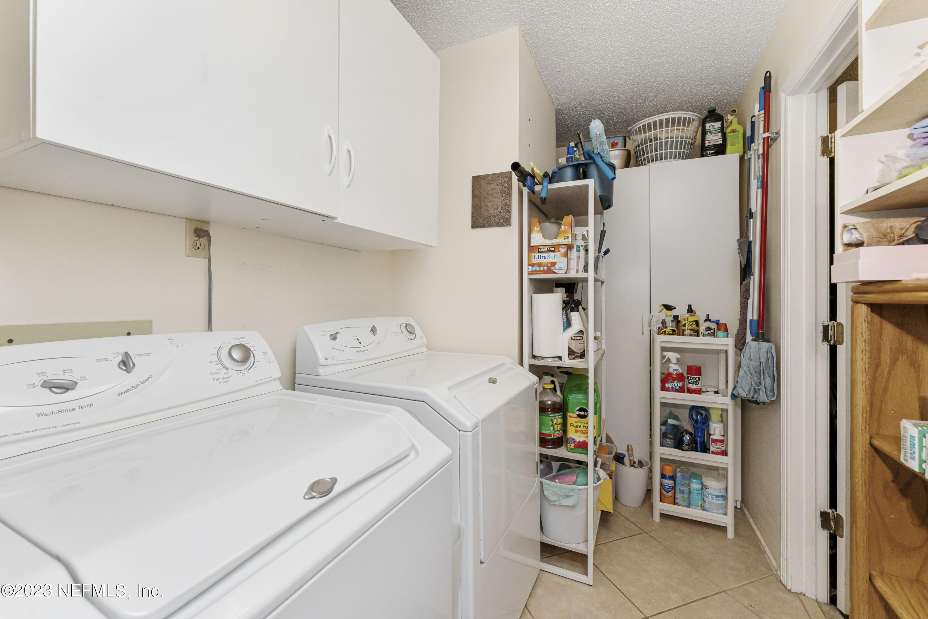 1676 Westwind Drive Jacksonville Beach, FL 32250 - Photo 19 of 42 a utility room with dryer and washer