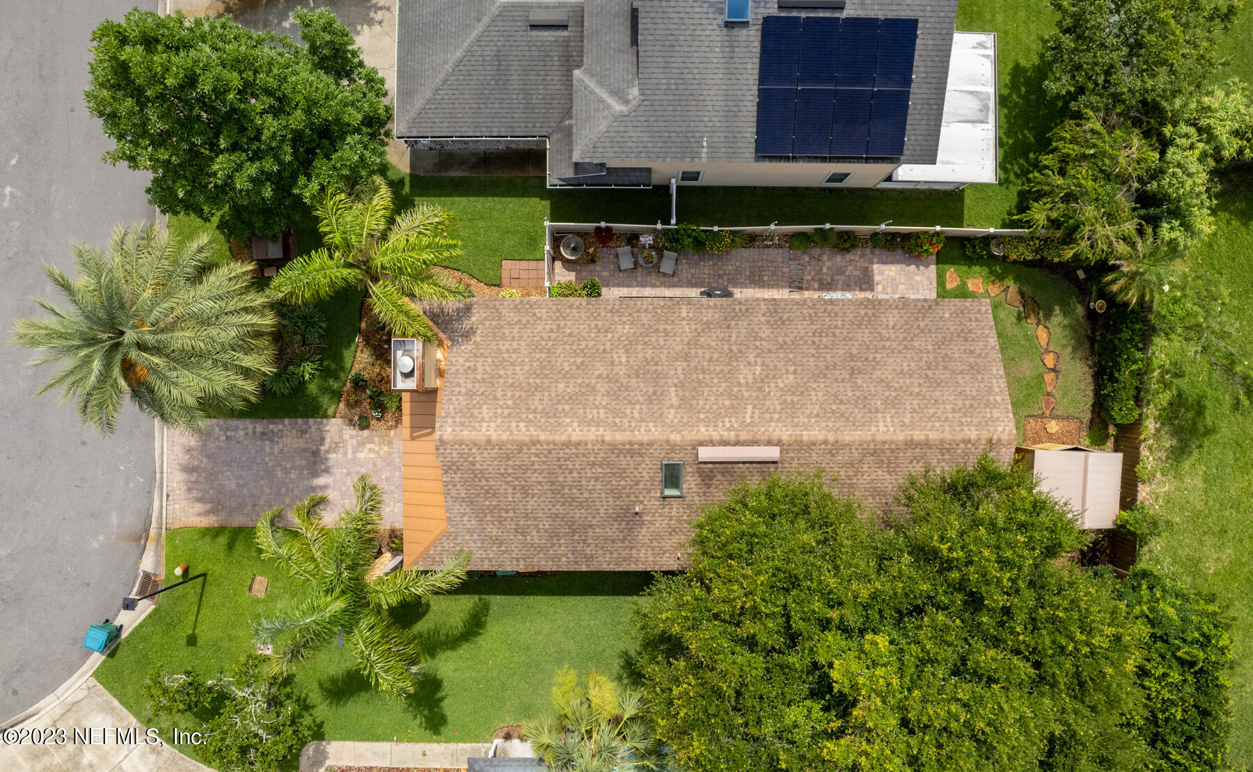 1676 Westwind Drive Jacksonville Beach, FL 32250 - Photo 20 of 42 an aerial view of a house with a yard and large trees