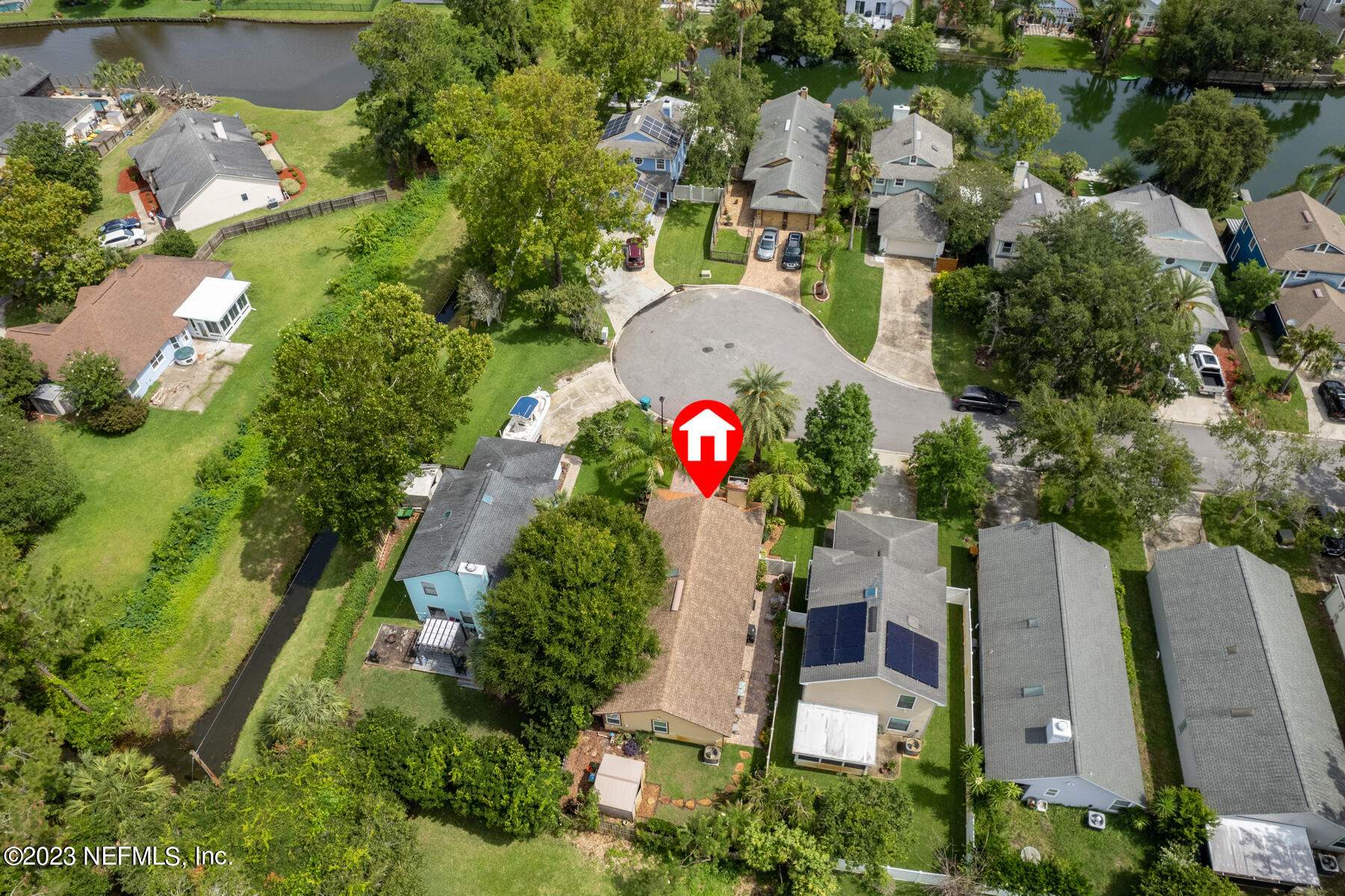 1676 Westwind Drive Jacksonville Beach, FL 32250 - Photo 2 of 42 an aerial view of a house with a yard and lake view