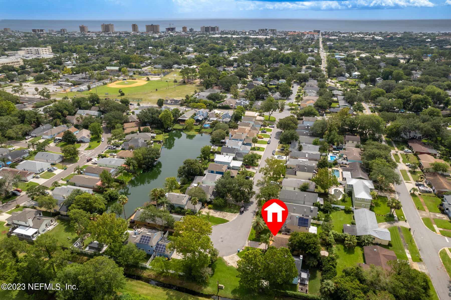 1676 Westwind Drive Jacksonville Beach, FL 32250 - Photo 31 of 42 an aerial view of residential houses with outdoor space and trees