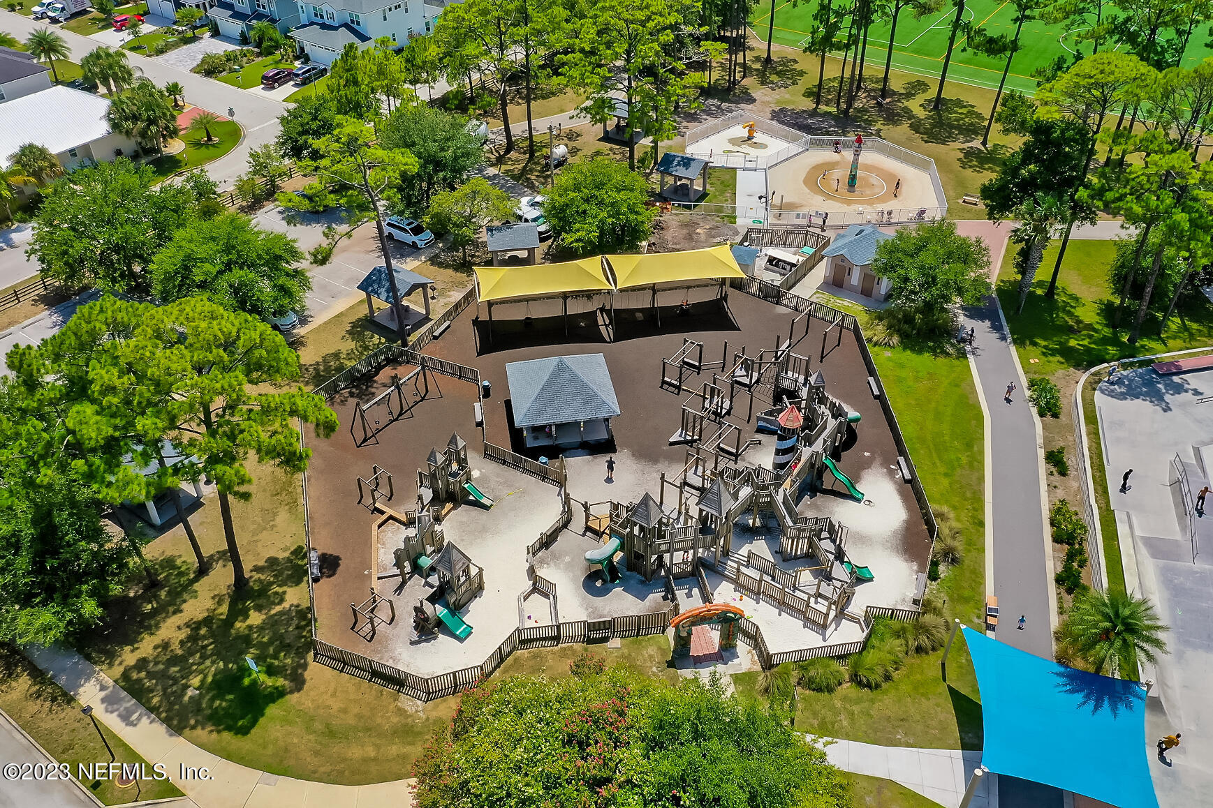 1676 Westwind Drive Jacksonville Beach, FL 32250 - Photo 33 of 42 an aerial view of a house with a yard and large trees