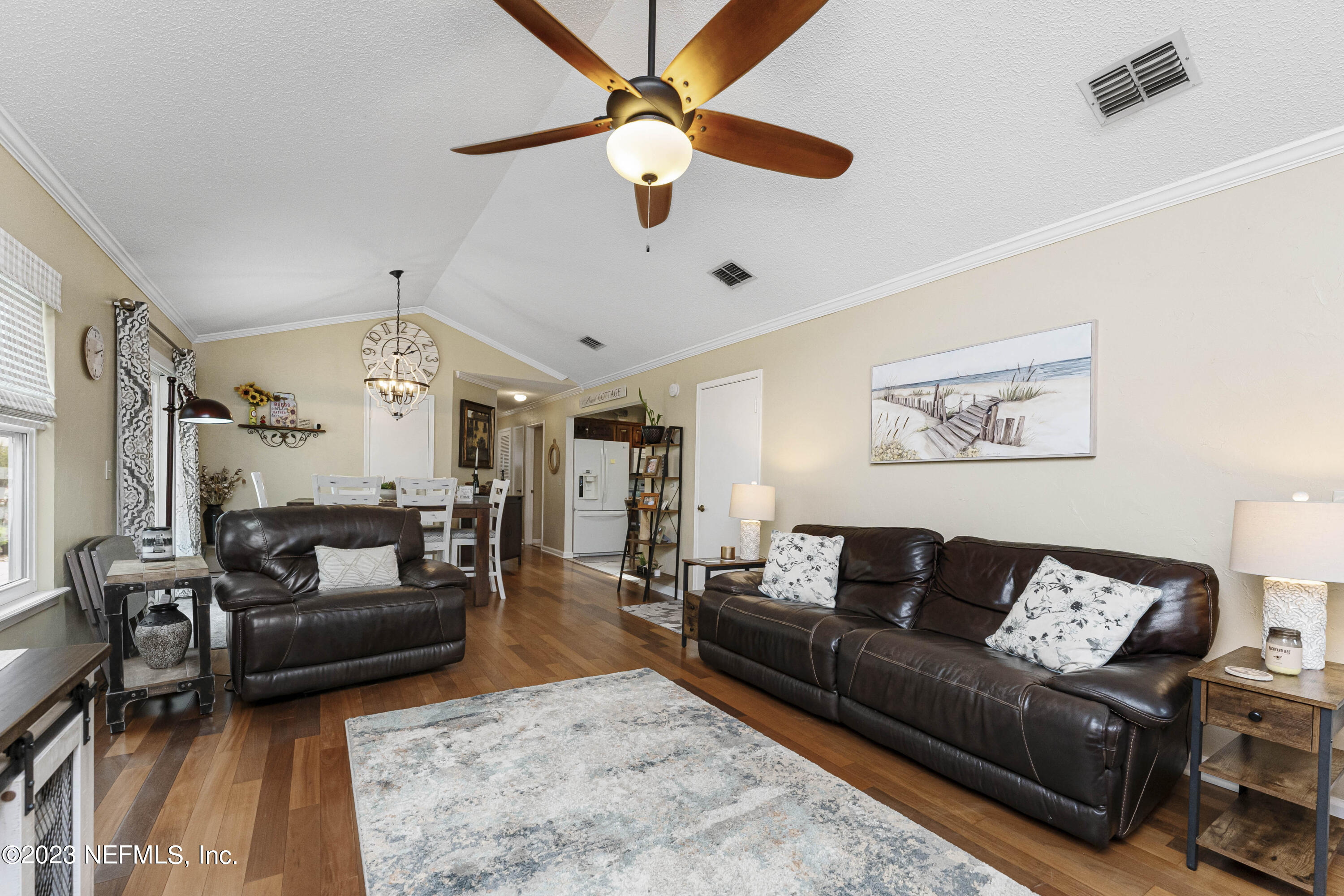 1676 Westwind Drive Jacksonville Beach, FL 32250 - Photo 4 of 42 a living room with furniture and a large window