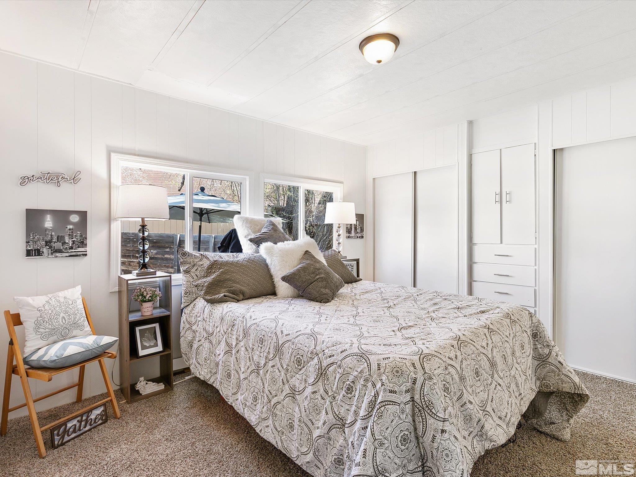 17560 Thrush Lane Reno, NV 89508 - Photo 15 of 27 a bedroom with a bed and chair